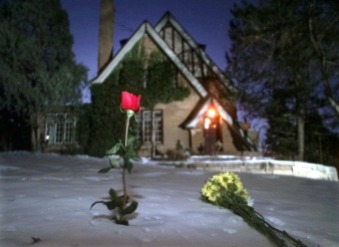 RAMSEYHOUSE.JPG Flowers rest in the snow outside the home of JonBenet Ramsey on the one-year anniversary of her murder, Friday Dec. 26, 1997, in Boulder, Colo. A candlelight vigil was scheduled for later in the evening. (AP Photo/Michael S. Green)